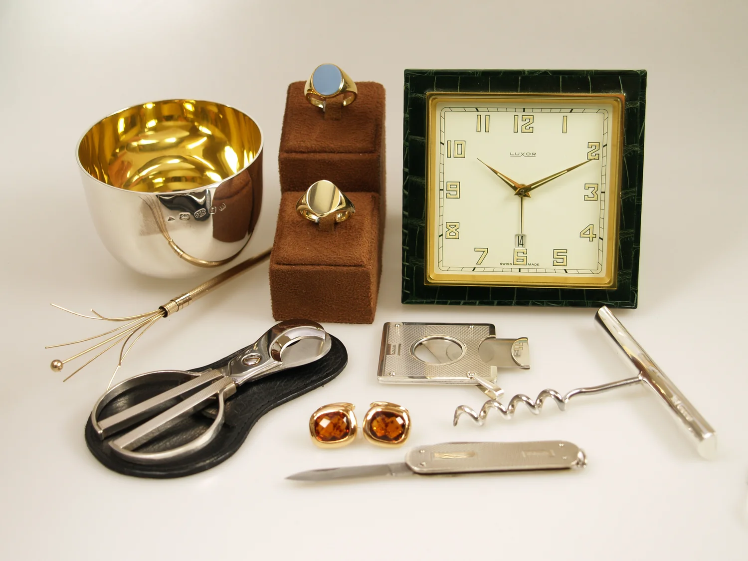 A gents jewellery and watch collection still life from Dawson of Stamford, signets, cufflinks and watches on display
