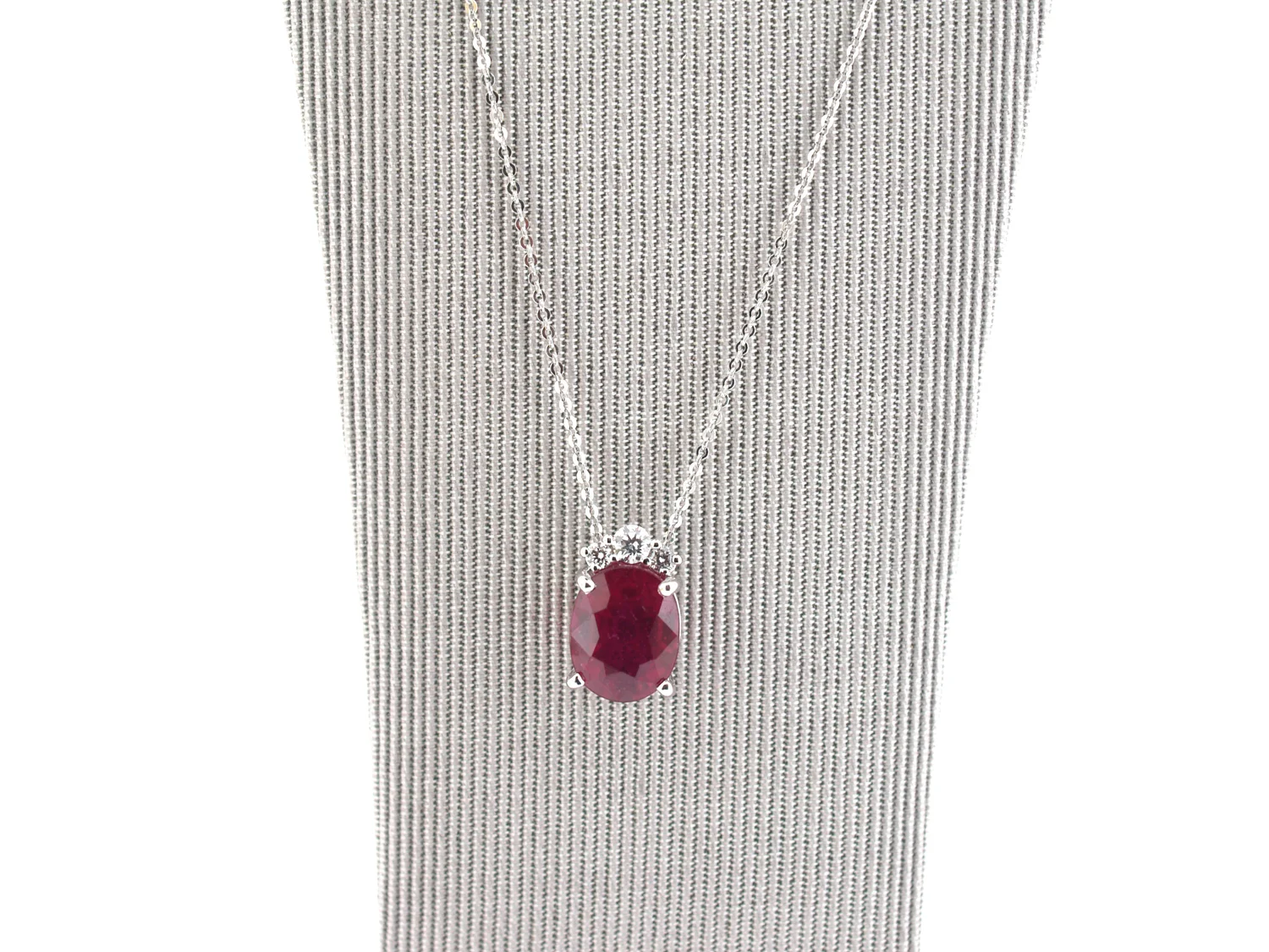 An antique pendant necklace from the Dawson of Stamford cabinet, photographed on plain ground