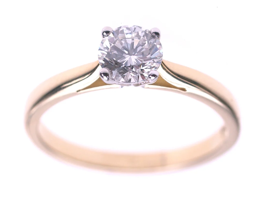 A gold antique ring from Dawson of Stamford, hand-mounted setting on a single stone